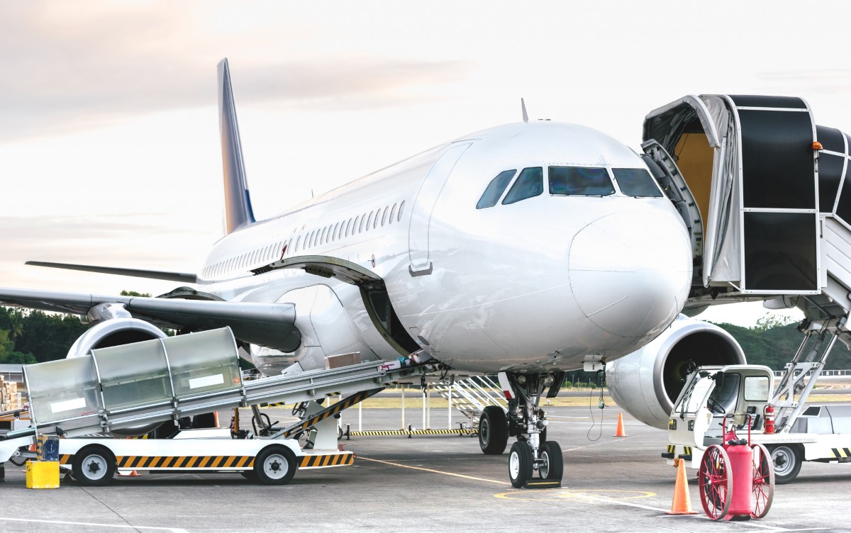 side-view-of-airplane-at-airport-terminal-gate-2024-07-03-02-44-15-utc.jpg